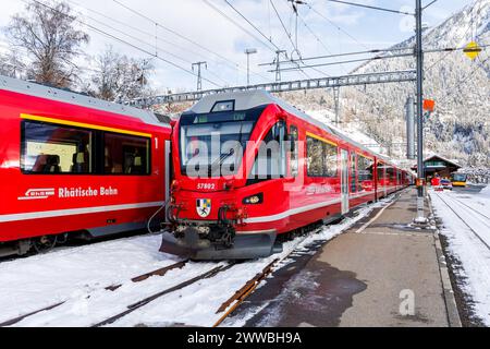 Filisur, Switzerland - January 10, 2024: Rhaetian Railway passenger trains on Albula line by Stadler Rail at train station in Filisur, Switzerland. Stock Photo