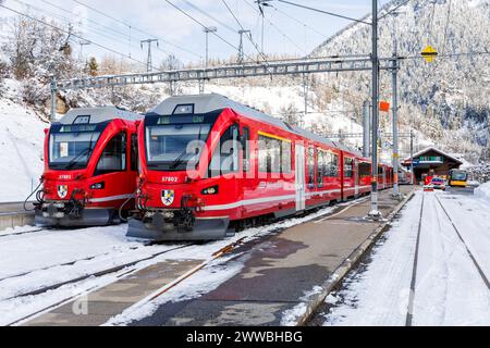 Filisur, Switzerland - January 10, 2024: Rhaetian Railway passenger trains on Albula line by Stadler Rail at train station in Filisur, Switzerland. Stock Photo