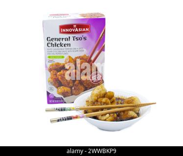 Ocala, Fl 3-5-2024 Innovasian general tsos chicken frozen cooked in bowl with chopsticks.  white chicken meat tempura and spicy asian style bbq sauce Stock Photo