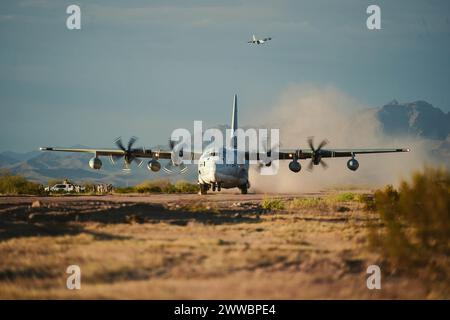 A U.S. Marine Corps KC-130J Hercules aircraft, assigned to Marine Aviation Weapons and Tactics Squadron One, lands on a refurnished runway Stock Photo