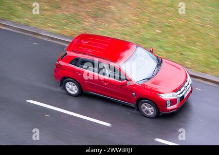 OSTRAVA, CZECH REPUBLIC - SEPTEMBER 23, 2023: Mitsubishi ASX crossover car after third facelift in motion blur effect in rain Stock Photo