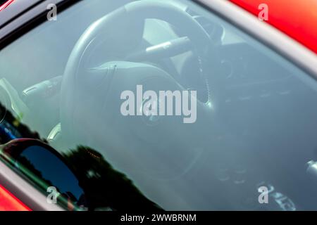 LINTHE, GERMANY - MAY 27, 2023: The interior through glass of sports car Alfa Romeo 4C, close-up. Die Oldtimer Show 2023. Stock Photo