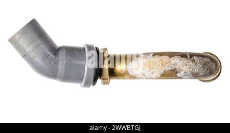 Corroded brass bathtub sewer pipe with plastic elbow isolated on white background Stock Photo