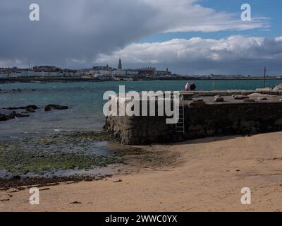 The harbour at Sandycove with Dún Laoghaire in the background. Dublin city, Ireland. Stock Photo