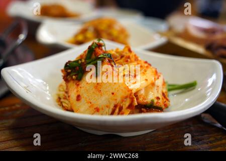 Fresh Kimchi is a type of kimchi and is a side dish made by seasoning cabbage and other vegetables immediately. Stock Photo