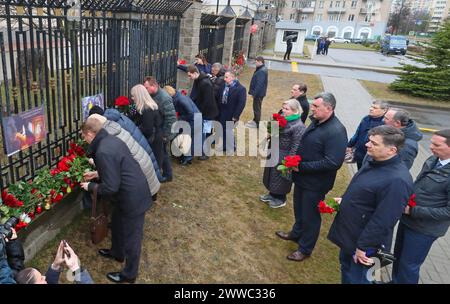 Minsk. 23rd Mar, 2024. People lay flowers to commemorate victims of Moscow terrorist attack in front of the Russian Embassy in Minsk, Belarus on March 23, 2024. The death toll from Friday's terrorist attack has risen to 143 after gunmen stormed a concert hall in Moscow, Margarita Simonyan, editor-in-chief of RT broadcast said Saturday. Credit: Henadz Zhinkov/Xinhua/Alamy Live News Stock Photo