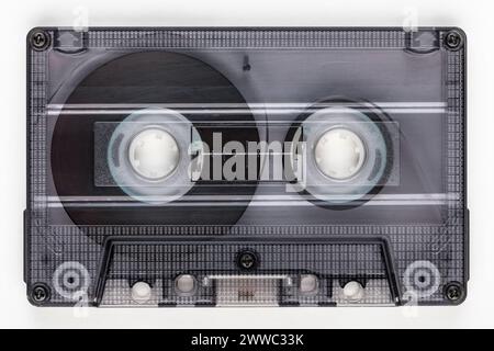 Transparent cassette tape with visible inner parts on white background Stock Photo