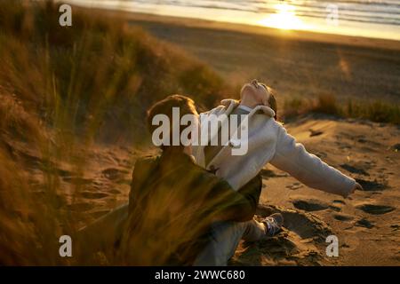 Young couple spending leisure time at beach Stock Photo