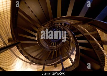 Stadtturm City Tower Spiral Staircase Innsbruck Austria. Looking down the spiral staircase inside the historic Town Tower or Stadtturm in the old town Stock Photo