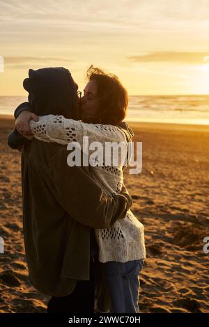 Loving couple kissing at beach Stock Photo
