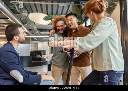 Diverse multiracial colleagues having fun at co-working space Stock Photo