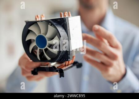 Engineer holding CPU fan at workshop Stock Photo