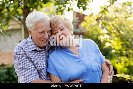 Happy elderly couple spending leisure time in garden Stock Photo