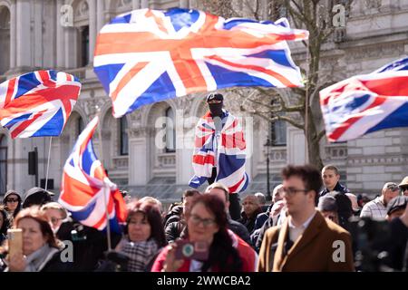 People take part in a 'Rally for British Culture' protest, organised by Turning Point UK, at the Cenotaph in Whitehall, London. Picture date: Saturday March 23, 2024. Stock Photo