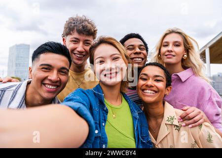 Urban young people taking selfie having fun together Stock Photo