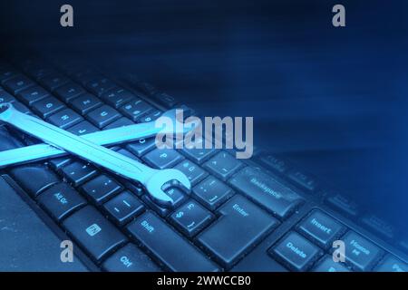 Electronic technical support concept. Wrenches Stock Photo