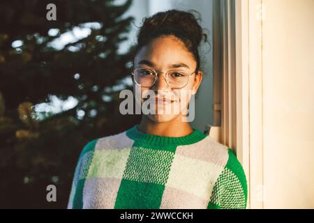 Smiling young woman wearing eyeglasses Stock Photo