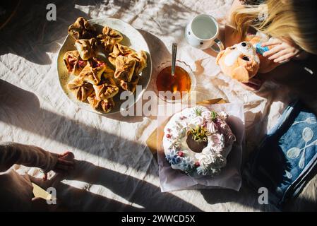 Cake and pastries kept on table at home Stock Photo