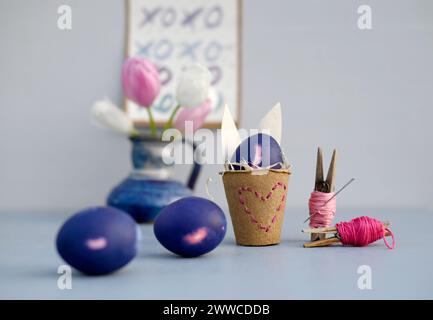 Studio shot of purple Easter eggs and homemade decorations Stock Photo