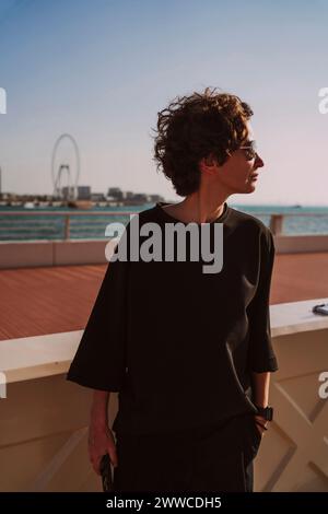 Mature woman in black t-shirt on sunny day Stock Photo