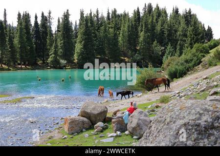 August 31 2023 - Semyonovka, Kyrchyn Valley in Kyrgyzstan: People enjoy the nature in the north of Kyrgyzstan mountains Stock Photo