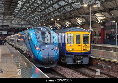 Last Northern Rail class 319, 319368 (right) at Liverpool Lime street on its last day in service with a Transpennine Express class 802, 2 January 2024 Stock Photo