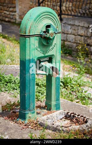 Dry Green Public Water Spigot Stock Photo