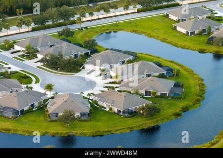 Low-density private homes. Rural street cul-de-sac dead end in residential suburbs with upscale suburban houses outside of Sarasota, Florida Stock Photo