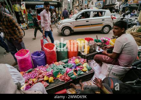 Guwahati, Assam, India. 23rd Mar, 2024. Vendor sells Holi celebration items in a street market, ahead of Holi festival on March 23, 2024 in Guwahati, Assam, India. Holi is the Hindu festival of colours, it is celebrated with great joy in India. Credit: David Talukdar/Alamy Live News Credit: David Talukdar/Alamy Live News Stock Photo