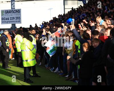 Chesterfield, UK. 23rd Mar, 2024. Chesterfield fans gather pitch side nearing full time during the Chesterfield FC v Boreham Wood FC Vanarama National League match at the SMH Group Stadium, Chesterfield, England, United Kingdom on 23 March 2024 Credit: Every Second Media/Alamy Live News Stock Photo