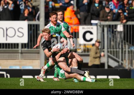 Exeter, UK. 23rd Mar, 2024. Josh Hodge of Exeter Chiefs gets tackled during the Gallagher Premiership Rugby match between Exeter Chiefs and Newcastle Falcons Rugby at Sandy Park, Exeter, UK on 23 March 2024. Photo by Scott Boulton. Editorial use only, license required for commercial use. No use in betting, games or a single club/league/player publications. Credit: UK Sports Pics Ltd/Alamy Live News Stock Photo