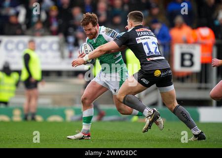 Exeter, UK. 23rd Mar, 2024. Joe Hawkins of Exeter Chiefs tackles Rory Jennings of Newcastle Falcons during the Gallagher Premiership Rugby match between Exeter Chiefs and Newcastle Falcons Rugby at Sandy Park, Exeter, UK on 23 March 2024. Photo by Scott Boulton. Editorial use only, license required for commercial use. No use in betting, games or a single club/league/player publications. Credit: UK Sports Pics Ltd/Alamy Live News Stock Photo