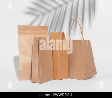 Craft paper bag, box. Brown beige eco packages, packs for product, gifts. Stock Photo