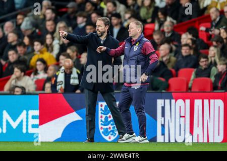 London, UK. 23rd Mar, 2024. England Manager Gareth Southgate and Assistant Manager Steve Holland during the England v Brazil International Friendly match at Wembley Stadium, London, England, United Kingdom on 23 March 2024 Credit: Every Second Media/Alamy Live News Stock Photo