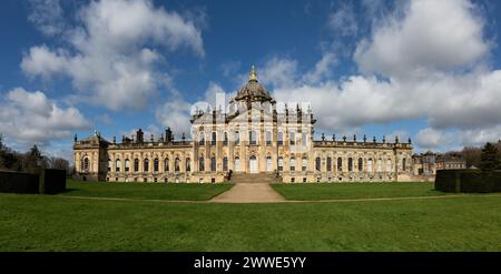 CASTLE HOWARD, YORK, UK - MARCH 23, 2024.  A landscape panorama of the front facade of Castle Howard Stately House in the Howardian Hills with sunshin Stock Photo