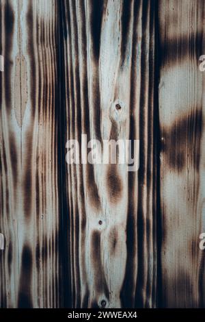 Texture of Burnt black and brown wooden planks. Stock Photo