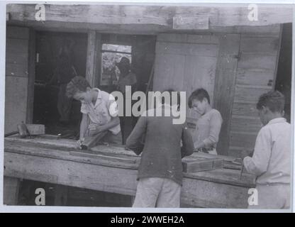 Students at St John's College in Belize participate in a carpentry class in 1948, demonstrating vocational education and practical skills in the Cayman Islands. Stock Photo