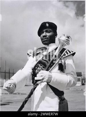 INF10-145-(4) Description: October is Black History Month, and we've chosen this image of Drum Major BL Reid of the Jamaica Regiment at Newcastle Hill Station, Jamaica. Date: 1955 Stock Photo