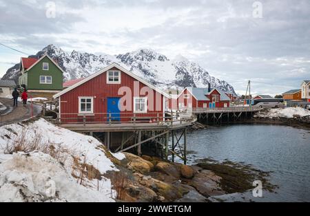 Scenic view of classic red norwegian houses in the fishing village of Henningsvær on Lofoten islands, northern Norway. Stock Photo