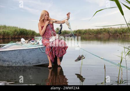 Beautiful Woman Cap Fishing While Sitting Stock Photo 1179152083