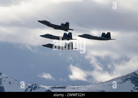 Members of the 3rd Wing and 90th Fighter Generation Squadron conduct a missing man formation flyover in remembrance of Staff Sgt. Charles A. Crumlett at Joint Base Elmendorf-Richardson, Alaska, March 22, 2024. The missing man formation is a military tradition which dates back to World War II and is one of the highest forms of paying respects to fallen service members. (U.S. Air Force photo by Senior Airman Julia Lebens) Stock Photo