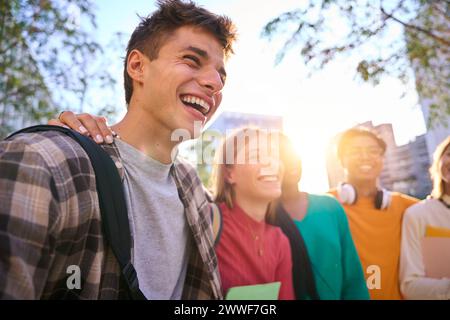 Happy young multiracial university students posing together taking a photo Stock Photo