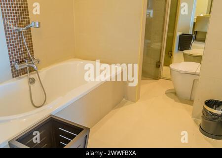 Spacious bathroom with a separate bathtub and shower area, in Chiang Mai, Thailand Stock Photo