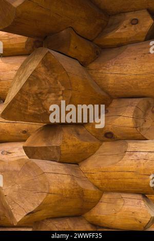 Stacked Eastern White pine logs forming the exterior corner walls on a luxurious Scandinavian style log home, Quebec, Canada Stock Photo