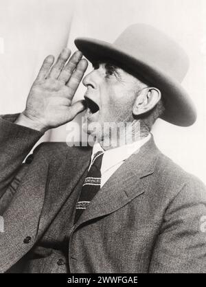 Oakland, California  1929    Ben F. Howard of Brown's Station, Truckee Meadows, Nevada, is the champion cow caller, bovine-baritonizer, or Holstein-enticer, or cow-cajoler, whose call can be heard for a distance of two miles. He recently demonstrated his ability at the Pacific Slope Dairy Show held here in Oakland. Stock Photo