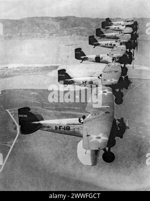 San Diego, California,   c. 1932 Unusual view of Boeing Navy fighters, which can climb from the ground to 10,000 feet and back in four and one-half minutes, in formation flying over San Diego. Stock Photo