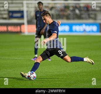 Durham, North Carolina, USA. 23rd Mar, 2024. North Carolina FC midfielder Louis Perez boots the soccer ball across the field. North Carolina FC hosted the Tampa Bay Rowdies at WakeMed Soccer Park in Cary, North Carolina. (Credit Image: © Patrick Magoon/ZUMA Press Wire) EDITORIAL USAGE ONLY! Not for Commercial USAGE! Stock Photo