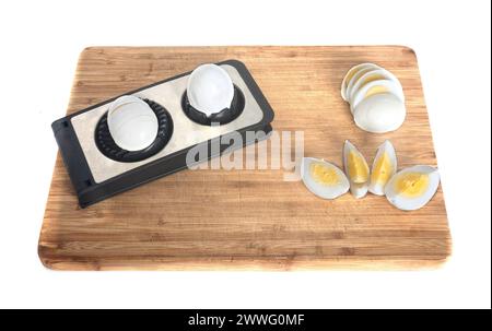 Egg slicer in front of white background Stock Photo