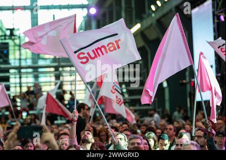 Madrid, Spain. 23rd Mar, 2024. Supporters of Sumar wave flags during the closure act of the first Assembly of the coalition. Sumar has held a founding assembly with the aim of providing the formation with an organizational structure celebrating its first assembly in La Nave, Villaverde. Credit: Marcos del Mazo/Alamy Live News Stock Photo