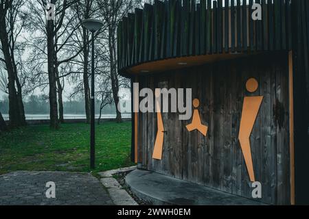 A creatively designed public restroom signage with a minimalistic and modern approach. Stock Photo